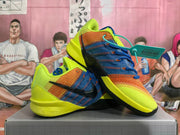 Pair of yellow, blue, and orange Nike basketball sneakers shown from a three-quarter side angle.