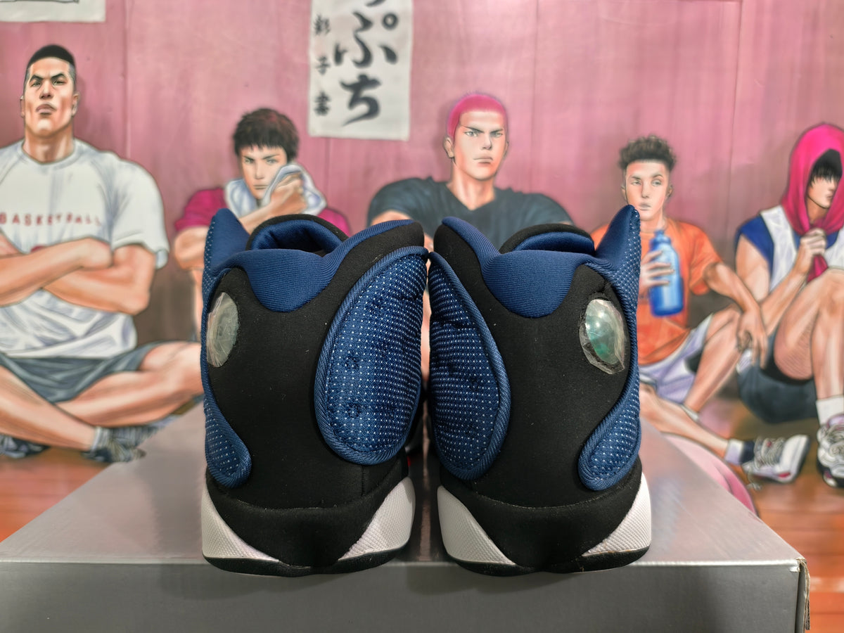 Rear view of black and deep blue high-top Jordan basketball sneakers