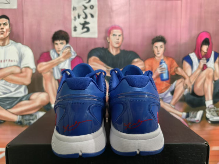 Rear view of blue Nike basketball sneakers showing the red heel signature detail, white midsoles and blue outsoles.
