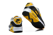 Rear and outsole views of Nike Air Max 90 sneakers.