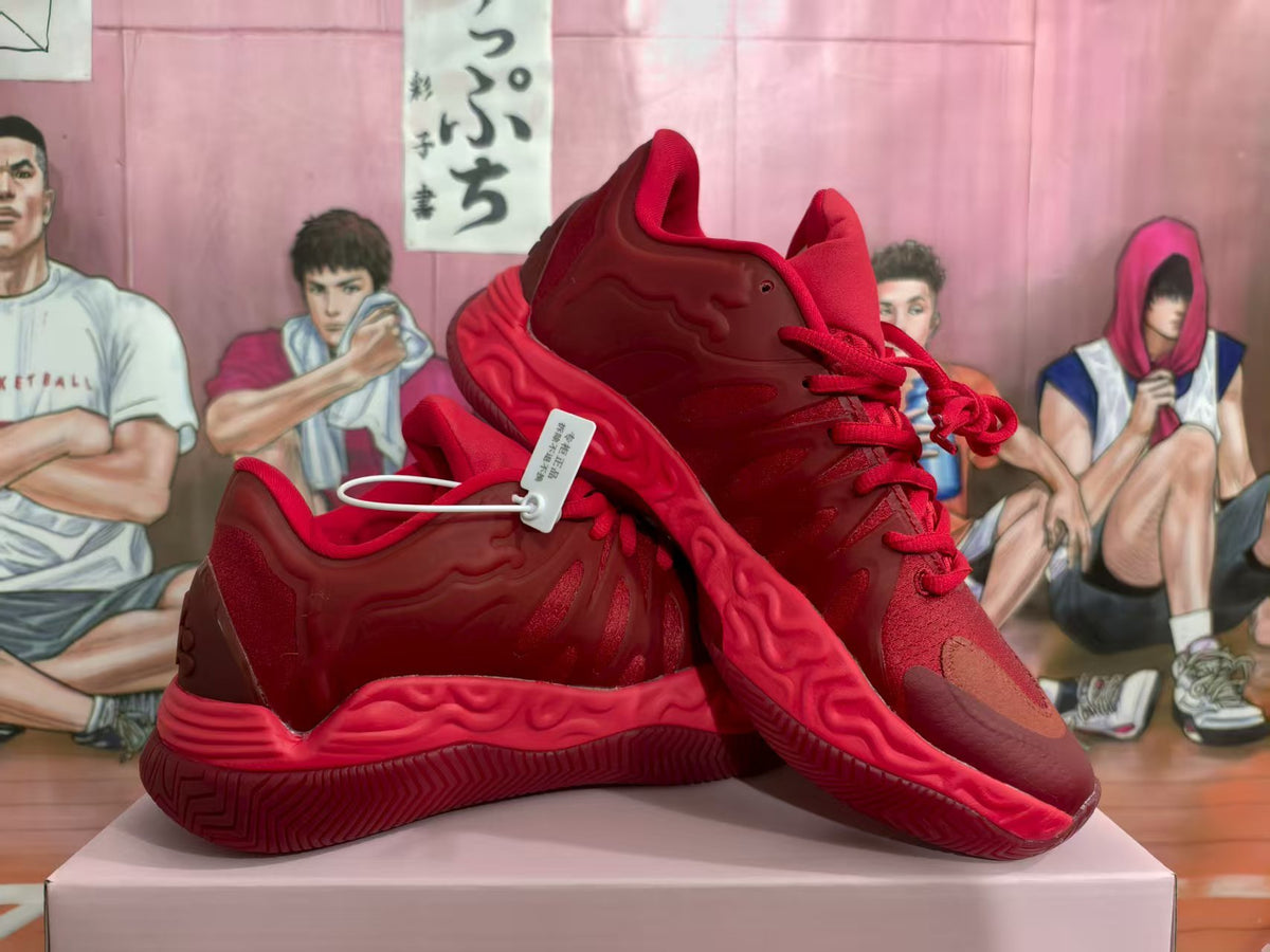 Pair of dark red basketball-style sneakers displayed from a three-quarter side angle.