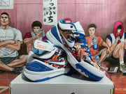 Angled view of the pair showing Nike side branding, illustrated panels, blue laces, and blue outsole details.