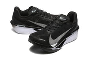 Pair of black Nike Zoom Fly 6 shoes with light-colored swooshes and white midsole sections