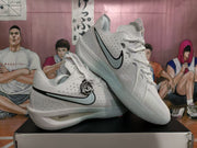 Angled view showing the perforated side panels, white laces, and LeBron-style details on the basketball shoes.