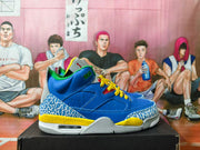Blue and yellow Jordan 3 sneakers shown from the side