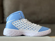 Opposite side view showing the light blue upper, white laces, side swoosh, and textured white outsole.