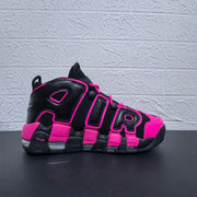 Side profile of a black and pink Nike Air More Uptempo sneaker