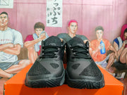 Front view of black Nike basketball shoes with laces and textured toe panels.