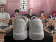 Rear view of the pair showing padded heel collars, heel ventilation holes, and Jumpman logos.