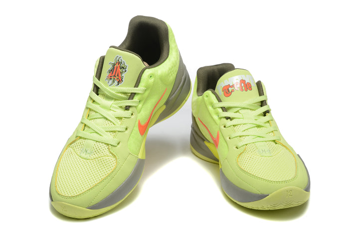 Pair of yellow-green Jordan basketball sneakers with orange accents shown from the front.