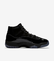 Studio side profile of a black high-top sneaker on a white background.
