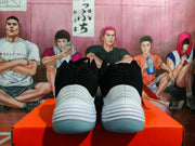 Rear view of black and white Nike basketball sneakers showing layered heel detailing and translucent outsoles.