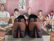 Rear view showing the patterned heel panels, Nike branding, and red outsole accents.