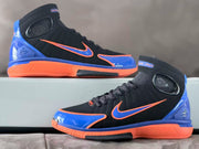 Side view of the black, blue, and orange basketball shoe pair