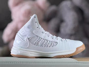 Side view showing the shoe's mesh panels, high collar, and white midsole