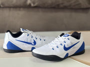 Pair of white and blue Nike Kobe 9 sneakers shown from a three-quarter angle.