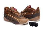 Brown sneakers shown in a three-quarter view with patterned uppers and dark contrasting side panels.