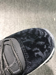 Close-up of the black textured toe box and black lacing system.
