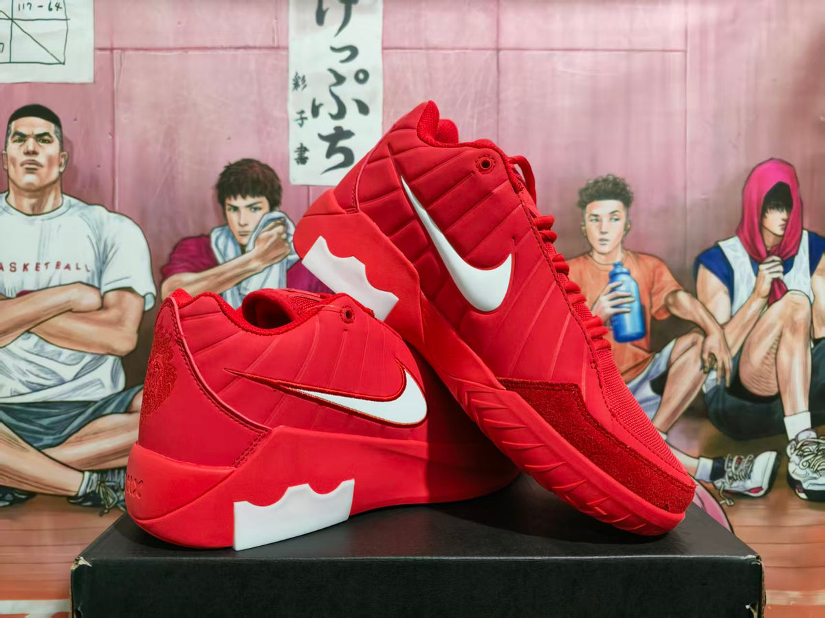 Pair of red Nike sneakers with white Swoosh logos displayed on a black box.