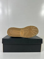 Close view of the gum-colored outsole with its circular and segmented traction pattern.