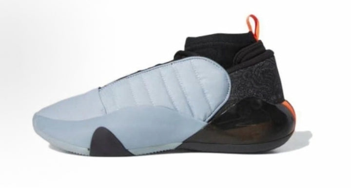 Side view of gray and black high-top sneakers with a padded ankle collar, rear pull tab, and orange heel detail.