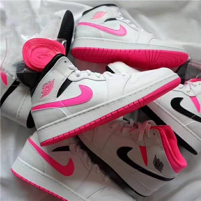 White Jordan 1 mid-top sneakers with pink and black accents and extra pink laces