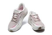 Front view of a pair of pale pink Nike lace-up sneakers