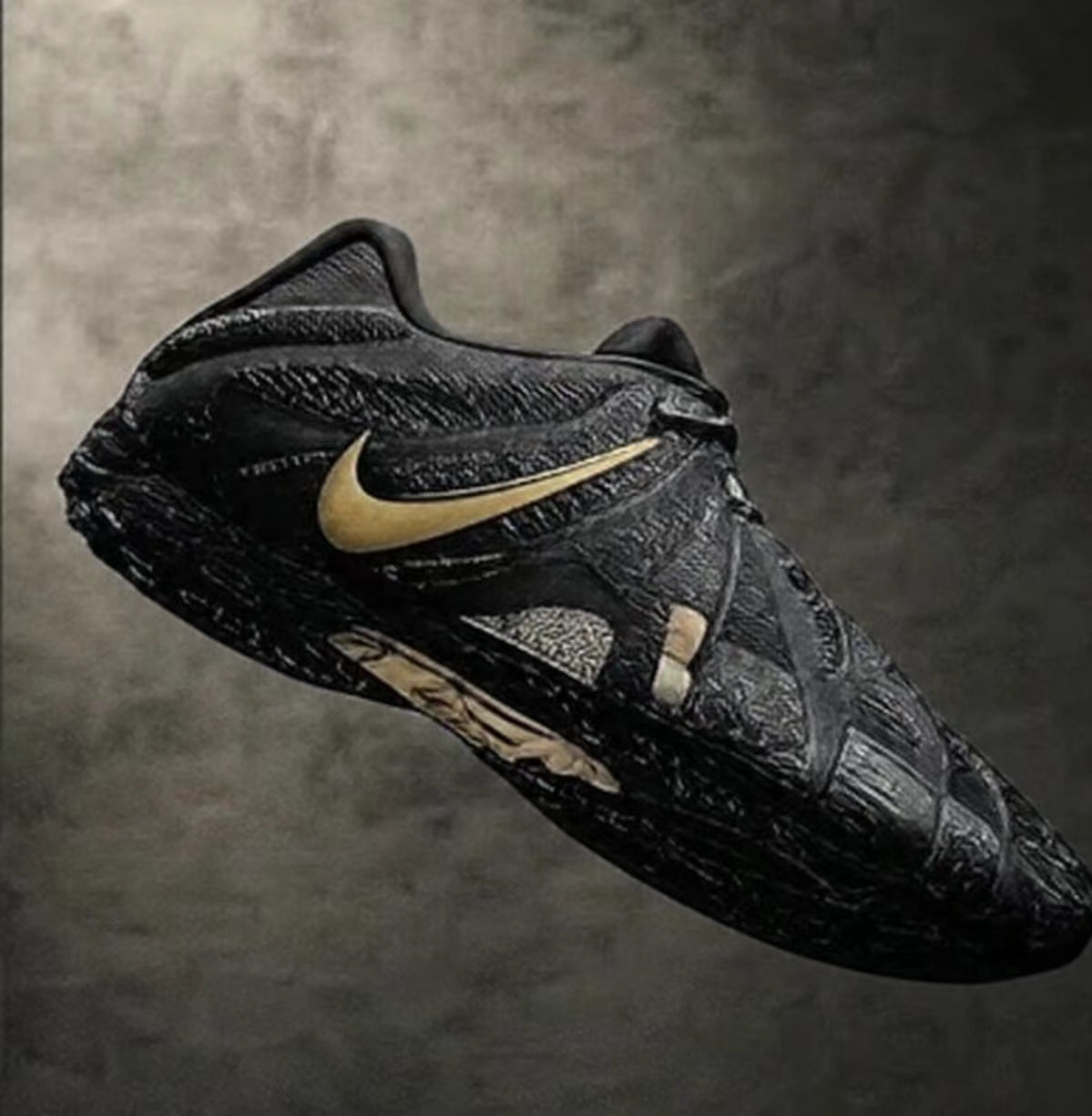 Black Nike sneaker with a gold-toned Swoosh and gold accent details, shown in side view.