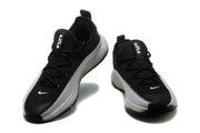 Pair of black and white low-top Nike LeBron training shoes shown from the front and side.