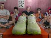 Front view of green Nike running sneakers with white laces, light mesh-style uppers, and RUN tongue markings.
