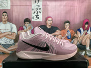 Side profile of a pink Nike basketball sneaker with a black Swoosh, lace-up upper, and pale contrasting sole.