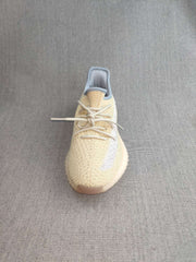 Top view showing the knit-style upper, laces, and reflective side detail.