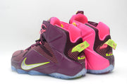 Rear three-quarter view showing the pink padded collars, structured ankle panels, and translucent outsoles.
