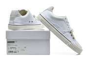 White low-top sneakers posed beside a box; the visible box label includes model text S57WS0391 and a size 40 marking.