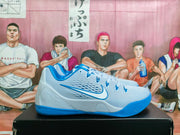 Side profile of a light blue and white basketball sneaker with a blue Nike Swoosh, padded collar, and blue outsole.