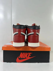 Rear view of the matching high-top sneakers showing red heels, black collars, and white midsoles.