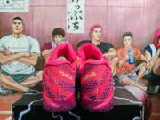 Rear view of the sneakers showing the padded collars and “TWELVE” text on both heels.