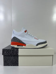 Side profile of the white and grey high-top sneaker with red heel detailing and a visible heel air window.