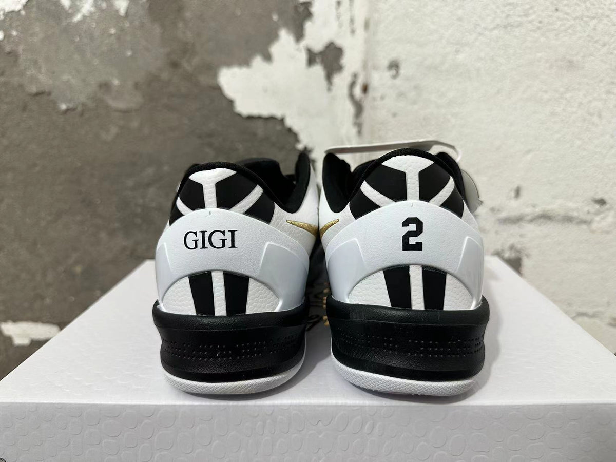 Rear view of black and white Nike Kobe shoes with GIGI and number 2 heel details