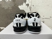 Rear view of black and white Nike Kobe shoes with GIGI and number 2 heel details