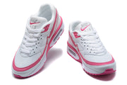 Front and top views of white and pink Nike Air Max BW-style sneakers.