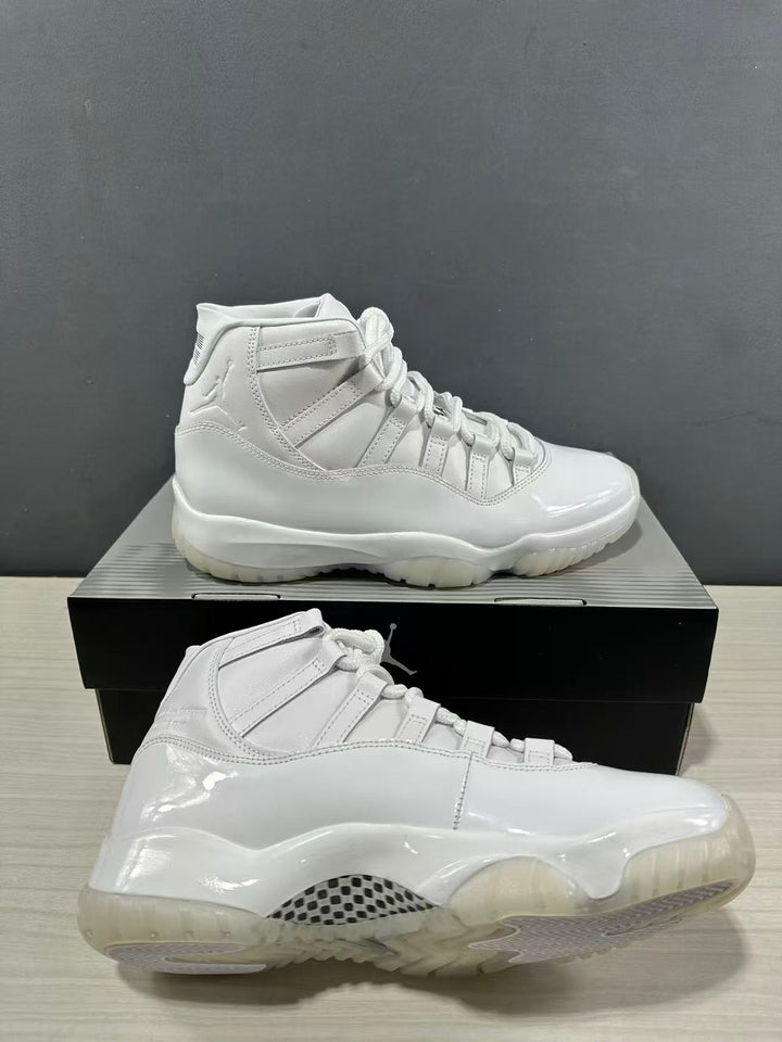 White high-top sneakers shown from the side on a black shoebox, with glossy panels and a translucent outsole.
