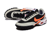 Angled top and front view of Nike Air Max Waffle SP sneakers with black laces and orange accents.