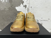 Front view showing the gold toe, laces, and tongue details
