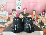 Rear view of black basketball shoes showing heel graphics and outsole details