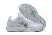 White Nike Sabrina 2 shoes showing the patterned outsole and mint traction details.