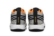 Rear view of the sneakers showing white midsoles, black heel tabs, spotted panels, and “CHAPTER ONE” text.