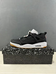 Single side profile showing the low-top silhouette, black upper, white midsole, and heel window.
