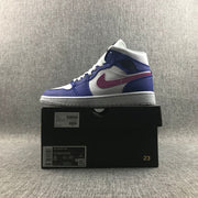 Side view of the sneaker displayed on its box; box label shows Air Jordan 1 Mid, style code 554724-451, and a photographed size label