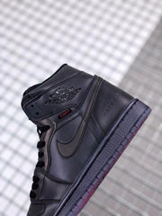 Close-up of the black sneaker side showing Jordan wing branding, Swoosh detailing, and Zoom graphic.
